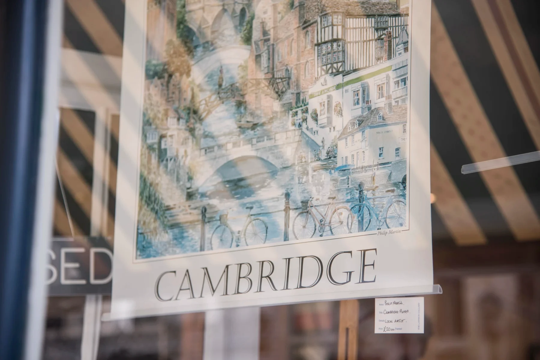Cambridge poster in shop window