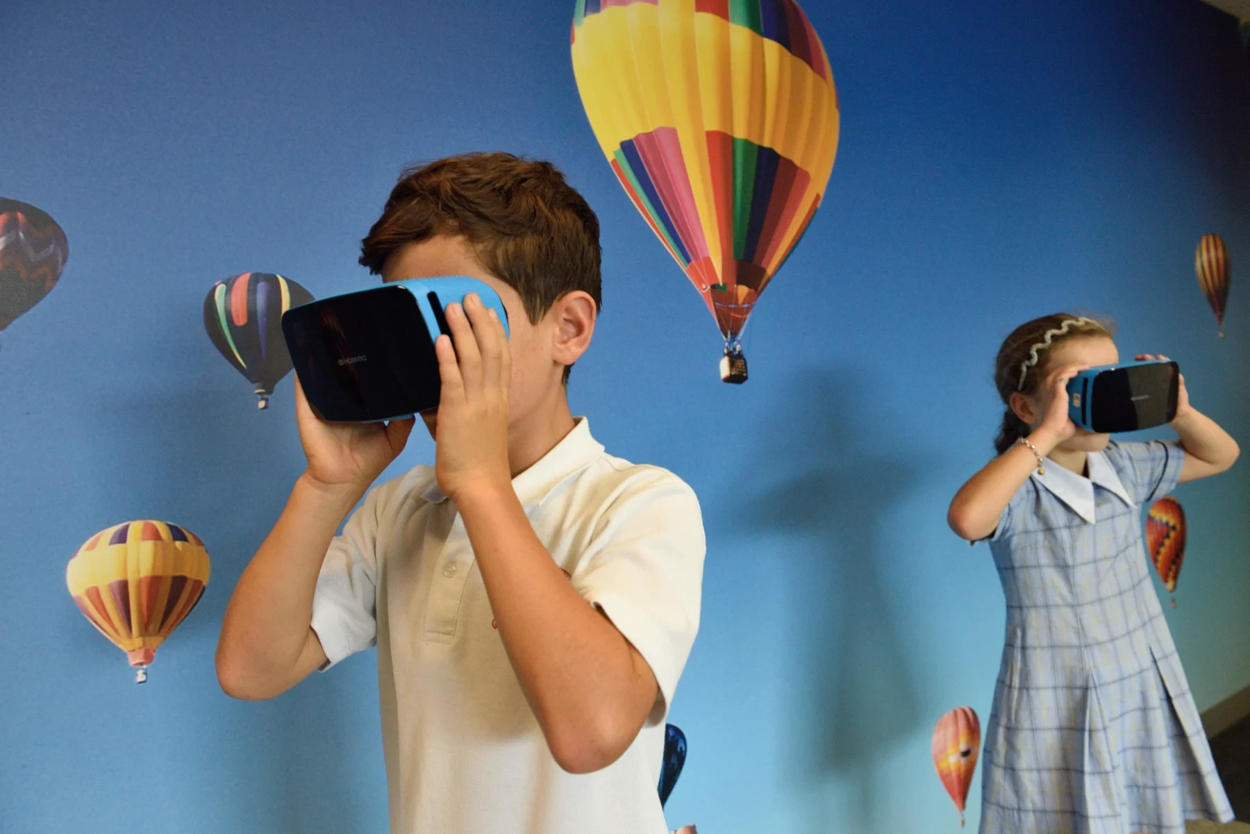 Two students wearing VR headsets